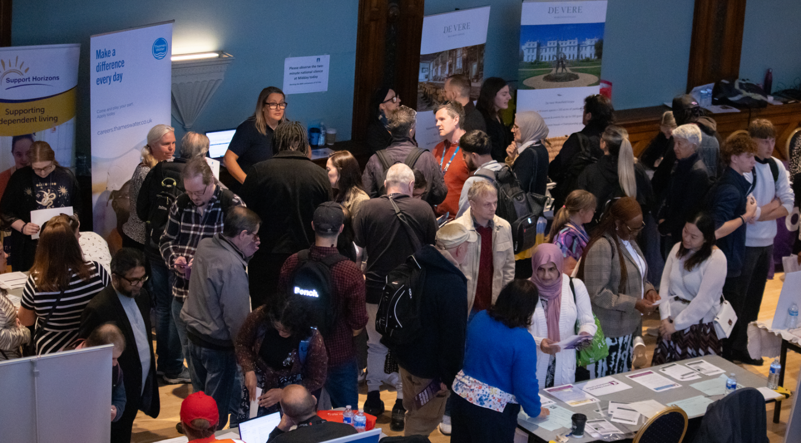 People talking to companies at a job fest